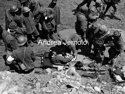 Seriously injured soldier receives comfort from a military chaplain  | Andrea Jemolo