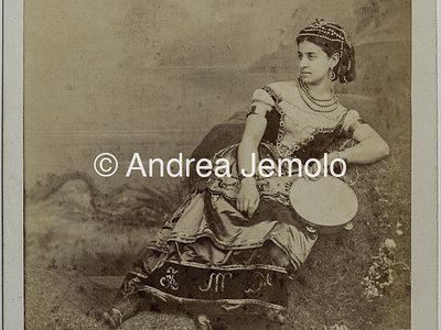  Portrait of young woman in a traditional dress and tambourine | Andrea Jemolo