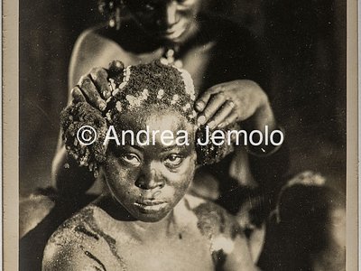 Transafrican expedition Baragiola-Durini Young woman gets coiled with strands of shells in her hair | Andrea Jemolo
