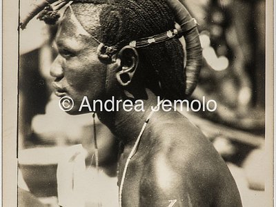 Transafrican expedition Baragiola-Durini Portrait of a young Masai man, with braided hair and collected in a typical hairstyle | Andrea Jemolo