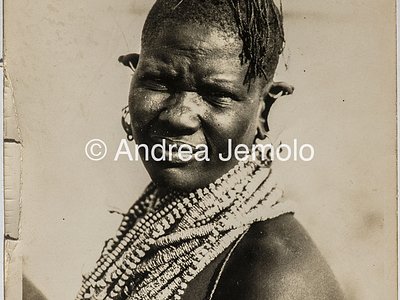 Transafrican expedition Baragiola-Durini Portrait of a woman from the tribe of Turkana. The woman has a hairstyle of pigtails and wears a characteristic beaded collar | Andrea Jemolo