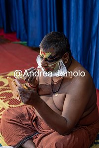 Kathakali Kathakali - A dancer from Kathakali, puts on his face before a show | Andrea Jemolo