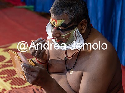 Kathakali Kathakali - A dancer from Kathakali, puts on his face before a show | Andrea Jemolo