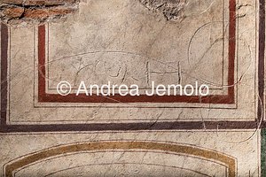 Roman latrine in via Garibaldi Engraving drawn on the still fresh plaster and depicting obscene symbols, as well as inscriptions in Latin and Greek | Andrea Jemolo