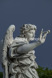 Ponte Sant'Angelo and the ten statues depicting Angels carrying the instruments of the Passion Angel with the nails with which Jesus was crucified | Andrea Jemolo